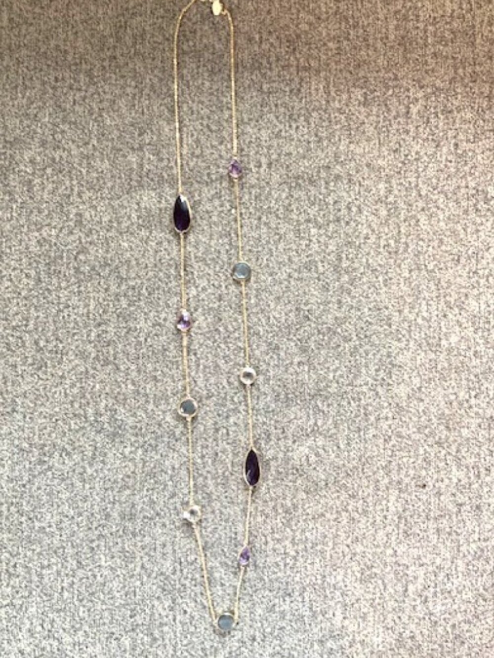 Loft - Gold chain with purple/gray stone details.
